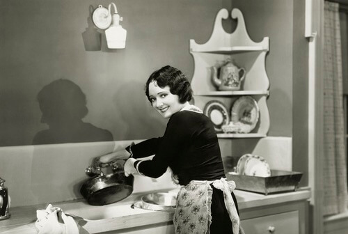 Housewife Cleaning Dishes in the Sink