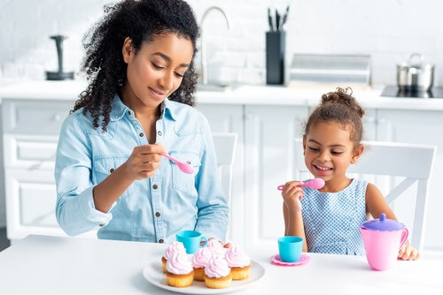 Mother and Daughter Making Cupcakes From Scratch