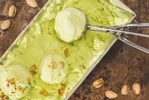 Scooping Homemade Pistachio Ice Cream