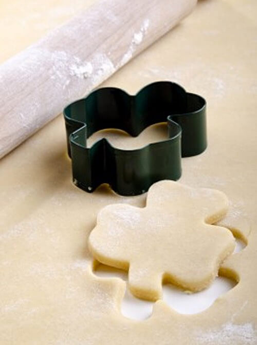 Shamrock Cookie Cutter and Cut Shamrock Cookie Ready for Baking