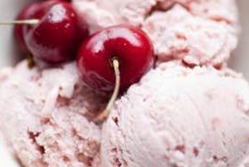 Homemade Cherry Ice Cream Topped with Whole Cherries