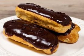 Three Chocolate Eclairs Ready to Serve