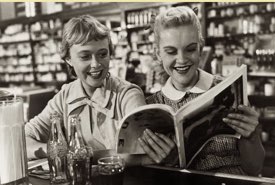 Two Young Girls Seated at an Old Time Soda Fountain Counter