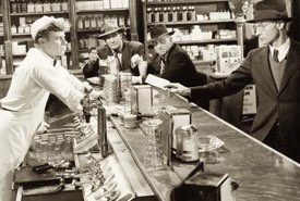 Vintage Soda Jerk Serving His Customers