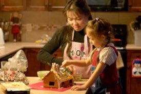 Mother and Daughter Making a Gingerbread House