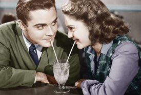 Young Couple Sharing an Ice Cream Milkshake