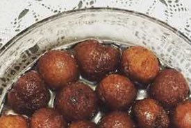 Indian Gulab Jamuns Frosted in Sugar Syrup