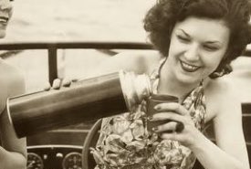 Young Lady Pouring a Drink from a Thermos