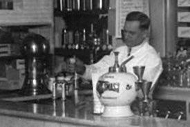 Vintage Soda Fountain Operator Behind the Marble Counter