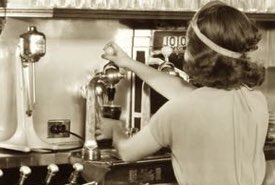 Soda Fountain Operator Dispensing a Soda Beverage