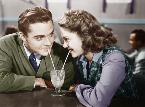 Couple Enjoying a Vintage Ice Cream Milkshake