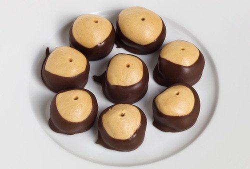 Get old fashioned Buckeye candy recipes and make the best Buckeye chocolate-dipped peanut butter balls you have ever tasted. They look and taste amazing.