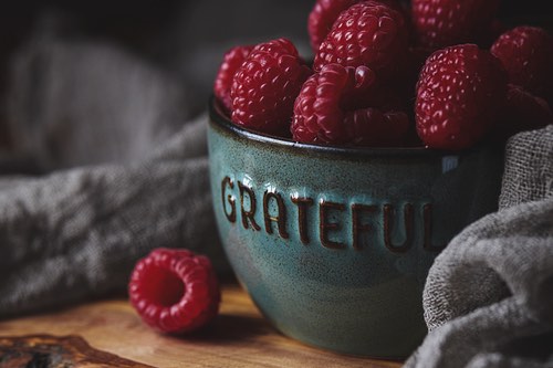 Fresh Raspberries in a Green Bowl