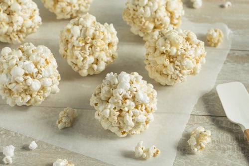 Get Grandma's old fashioned popcorn balls recipes. Candied popcorn is so easy to make, and it's delicious and fun to eat anytime you feel the urge to snack.