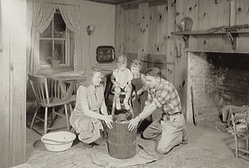 Family Having Fun Making Homemade Ice Cream in 1946