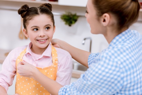 Young Girl Wearing an Apron